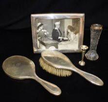 ANTIQUE SILVER MOUNTED ITEMS To include a monogrammed hairbrush and hand mirror, hallmarked London