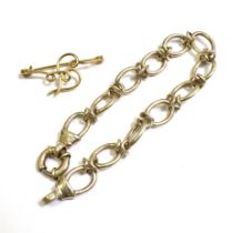 GOLD BROOCH & SILVER BRACELET Brooch tests as 9ct gold, comprising round wire forming an 'F'