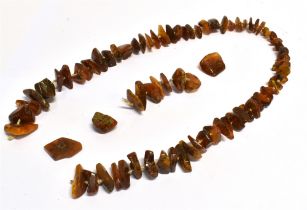 ANTIQUE BALTIC AMBER NECKLACE Approx 72cm long, (broken) comprising polished pieces of raw amber,