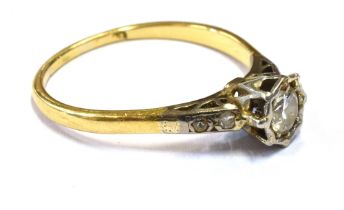 18CT GOLD & DIAMOND SOLITAIRE RING A platinum illusion claw set round brilliant cut diamond,