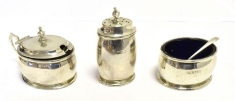 NEAR MATCHING THREE PIECE SILVER CRUET SET Together with two silver condiment spoons and two blue