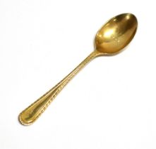 9CT GOLD TEASPOON With chased handle, monogrammed 'E' to terminal and bowl engraved '1906 1956'.