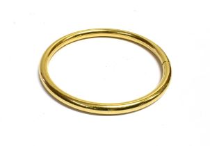 HEAVY GOLD PLATED BANGLE 7cm internal diameter, 5.9mm wide of rounded hollow form. Weight 18.6