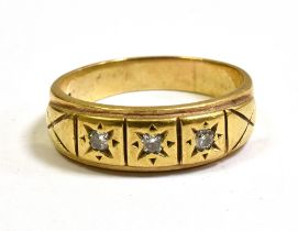 GENTS GOLD & DIAMOND DRESS RING In 9ct gold, 7.8mm wide star grain set head with three round
