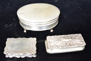 THREE ANTIQUE SILVER PATCH BOXES To include one of oval form on scroll feet, monogramed 'R' with