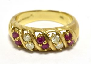 9CT GOLD, DIAMOND AND RUBY DRESS RING. Shank with faded 375 marking DIA 0.2. Ring size N weight 4g