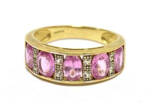 TJC 375 PINK SAPPHIRE DRESS RING. The ring set with five faceted oval pink sapphires measuring