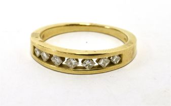 9ct GOLD, DIAMOND HALF BAND ETERNITY RING. Seven small lozenge cut diamonds semi tension set on a