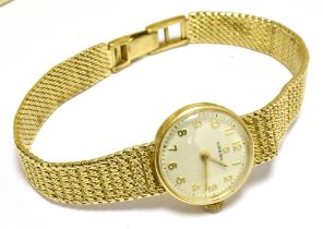 OMEGA - A 1960's LADIES 9CT GOLD WATCH Signed champagne dial, gilt Arabic numerals and batons -