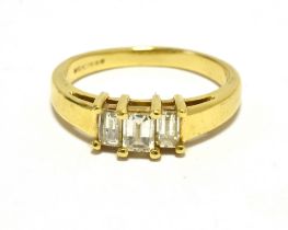 THREE STONE DIAMOND RING 18CT GOLD Diamonds baguette cut, faded 750 mark. Ring size P weight 4.3g