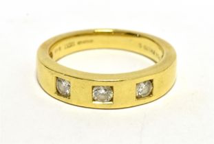 18CT GOLD DIAMOND THREE STONE RING The brilliant cut diamonds each measuring approx 2mm in diameter.