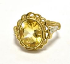 GOLD CITRINE COCKTAIL RING 9CT The Oval faceted citrine measuring 9 x 8mm approx and flanked each