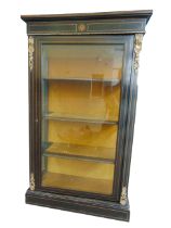 A 19TH CENTURY EBONIZED PIER CABINET with boxwood stringing and gilt metal mounts, the hinged door