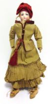 A FRENCH BISQUE SHOULDER HEAD 'PARISIENNE' FASHION DOLL, PROBABLY BY FRANCOIS GAULTIER circa 1870,
