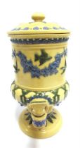 A DOULTON LAMBETH STONEWARE WATER FILTER with blue and green sprigged fruiting vine, bird and