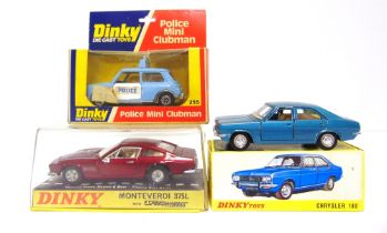 THREE DINKY DIECAST MODEL CARS comprising a French Dinky No.1409, Chrysler 180, metallic blue,