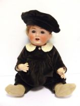 A KESTNER FOR CATTERFELDER PUPPENFABRIK BOY CHARACTER DOLL with a cropped brown wig, sleeping