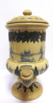 A DOULTON LAMBETH STONEWARE WATER FILTER with blue and green sprigged tug-of-war, floral and foliate