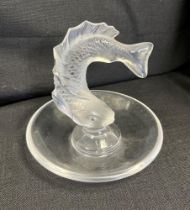 A LALIQUE GLASS TRINKET DISH centred with a turning fish, the base engraved 'Lalique / France',
