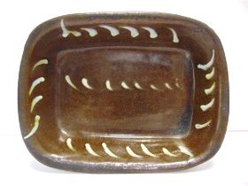 AN ENGLISH OR WELSH SLIPWARE BAKING DISH probably late 18th or early 19th century, possibly Buckley,