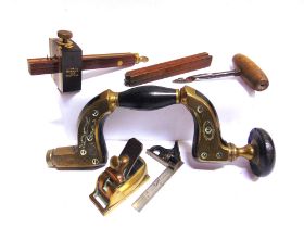 ASSORTED TOOLS comprising a small brass plane, unmarked, 8.25cm long; a late 19th century Marples