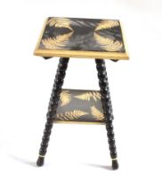 A PAINTED OCCASSIONAL TABLE the top and under-tier with stencil-sprayed fern decoration, on