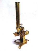 A PATINATED BRASS MONOCULAR MICROSCOPE, NEWTON & CO., LONDON with rack and pinion focus