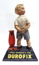 A DUROFIX RUBBER COMPOSITION POINT-OF-SALE ADVERTISING FIGURE in the form of a boy with a catapult