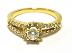 TJC 18K DIAMOND WRAP OVER RING (YELLOW GOLD) Centrally set with a round brilliant cut measuring