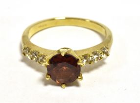 GARNET DRESS RING White quartz set shoulders, yellow metal band, shank marked 9k- small other