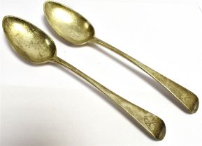 GEORGE IV SILVER SPOONS (2) A pair of silver serving spoons with crested terminals, Hallmarked
