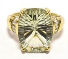 9CT GOLD AQUAMARINE COCKTAIL RING. The faceted barrel cut Aquamarine (greenish-Blue) measuring 1.6 x