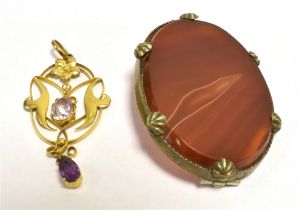 EARLY 20TH CENTURY GEM SET PENDANT Together with a banded agate brooch. The open work pendant set