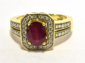 ILIANA 18k RUBY AND DIAMOND COCKTAIL RING Faceted oval ruby measuring 7.5 x 5mm approx set in a