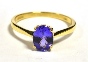 ILIANA 18K GEM SET COCKTAIL RING The ringset with a faceted oval purple garnet measuring 9 x 5mm,