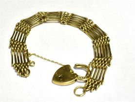 9CT GOLD HEART PADLOCK GATE BRACELET Six bar bracelet width 11mm length 17.5cm approx. Working heart