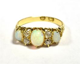 LATE 19th/20th CENTURY 18CT OPAL AND OLD CUT DIAMOND DRESS RING Central Opal Oval 6 x 5mm approx,