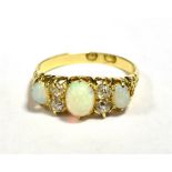 LATE 19th/20th CENTURY 18CT OPAL AND OLD CUT DIAMOND DRESS RING Central Opal Oval 6 x 5mm approx,