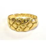 18CT GOLD DRESS RING The tapered band featuring an engraved patterned centre, hallmarked