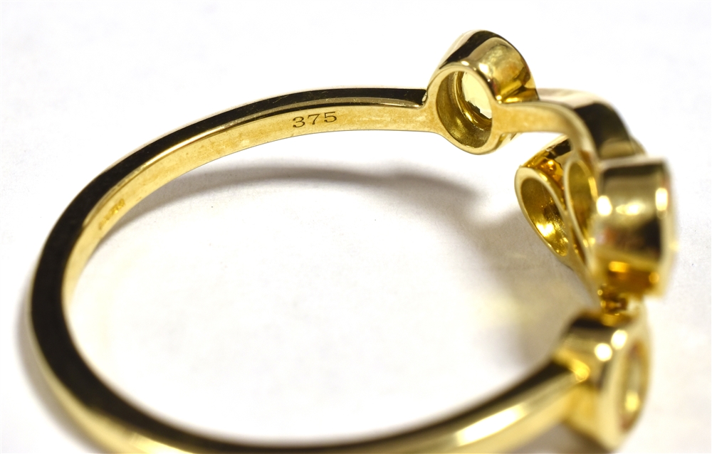 9CT GOLD YELLOW SAPPHIRE RING The ring tension set in open work boat design with five small oval - Image 2 of 2