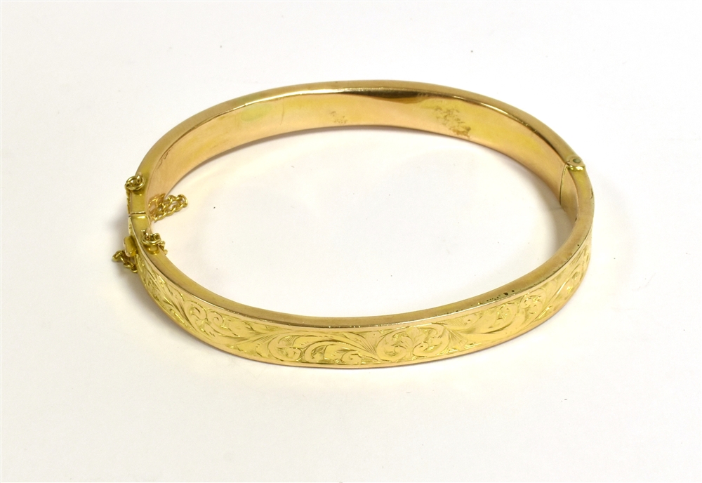 9CT GOLD HALF ENGRAVED PATTERNED BANGLE very worn hallmark, working push clasp, intact safety chain,