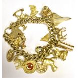 VINTAGE CHARM BRACELET Comprising 9CT gold and yellow metal working 9CT heart padlock clasp. Total