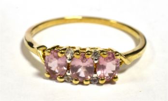 10KT PINK SAPPHIRE, THREE STONE DRESS RING Shank marked 417 10KT, Ring size U, Weight 2g