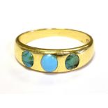 18CT GOLD TURQUOISE SET THREE STONE DRESS RING. The Tapered band set with three turquiose stones,