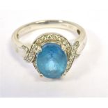 ILIANA 18K WHITE GOLD CLUSTER RING the cluster comprising an oval turquoise glass stone in a diamond