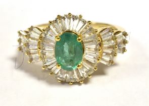 9CT GOLD EMERALD CLUSTER RING The faceted Oval Emerald measuring 7 x 5mm in a clear stone accent