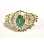 9CT GOLD EMERALD CLUSTER RING The faceted Oval Emerald measuring 7 x 5mm in a clear stone accent