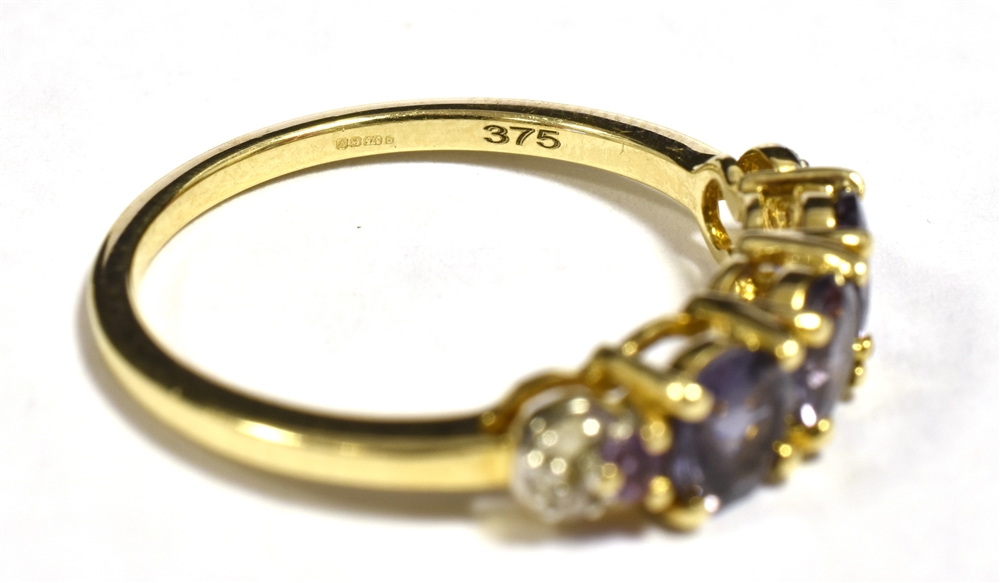 9KT GOLD, PURPLE SAPPHIRE THREE STONE DRESS RING The ring with diamond accent shoulders, ring size N - Image 2 of 2