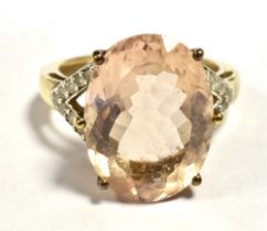 9CT GOLD MORGANITE AND DIAMOND COCKTAIL RING The Oval faceted Morganite measuring 15mm x 11mm with
