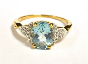 10KT GOLD AQUAMARINE COCKTAIL RING The ring set with a blue faceted oval aquamarine. Measuring 8 x